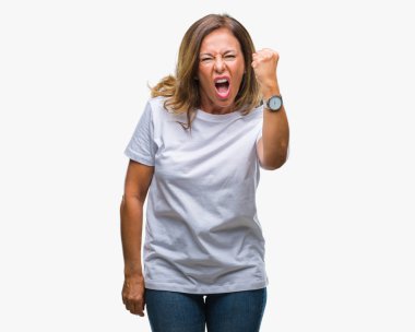 Orta yaş üst düzey İspanyol kadın izole arka plan öfkeli ve sinirli sinirli ve öfke ile bağırarak süre öfkeli yumruk yükselterek yüzünden. Öfke ve agresif kavramı.