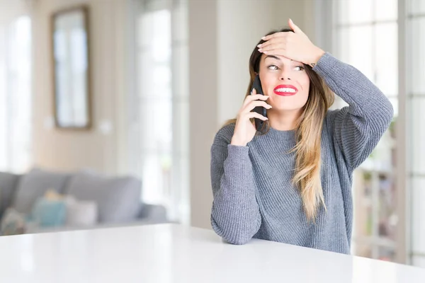 Young Beautiful Woman Talking Phone Home Stressed Hand Head Shocked — Stock Photo, Image