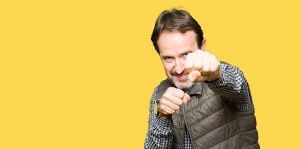 Middle Age Handsome Man Wearing Winter Vest Punching Fist Fight — Stock Photo, Image