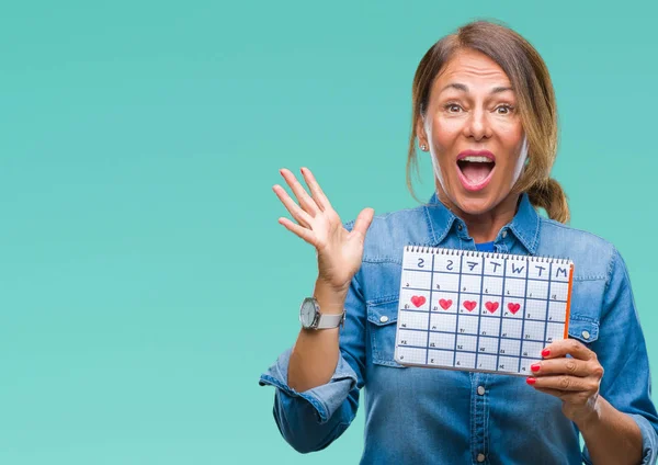 Middelbare Leeftijd Senior Spaanse Vrouw Houdt Van Menstruatie Kalender Geïsoleerd — Stockfoto