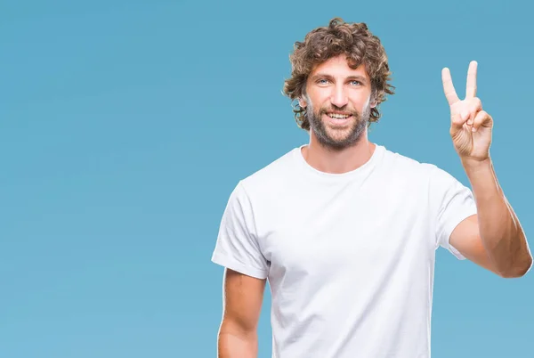 Hombre Modelo Hispano Guapo Sobre Fondo Aislado Mostrando Apuntando Hacia —  Fotos de Stock