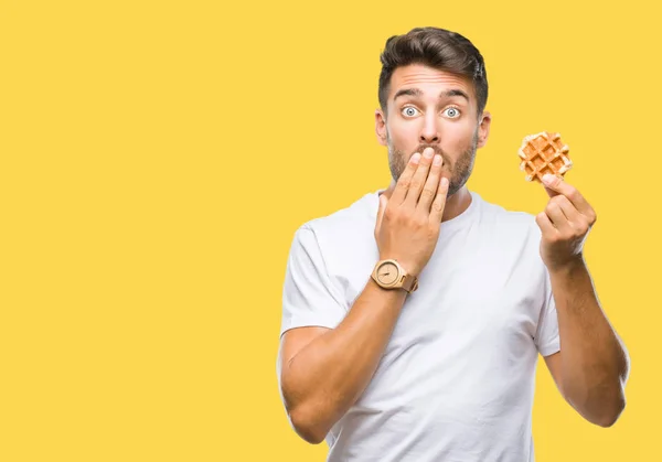 Young Handsome Man Eating Sweet Waffle Isolated Background Cover Mouth — Stock Photo, Image