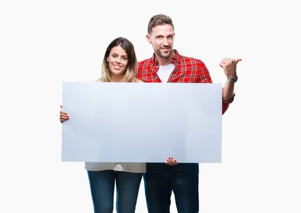 Young Couple Together Holding Blank Banner Isolated Background Pointing Showing — Stock Photo, Image