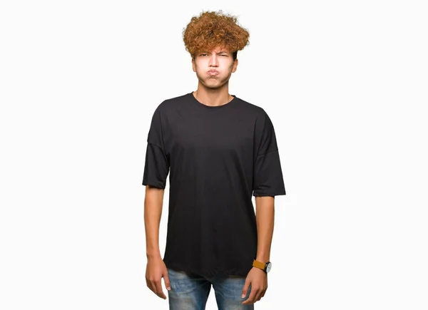 Young Handsome Man Afro Hair Wearing Black Shirt Puffing Cheeks — Stock Photo, Image