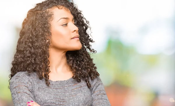 Young Beautiful Woman Curly Hair Wearing Grey Sweater Smiling Looking — Stock Photo, Image