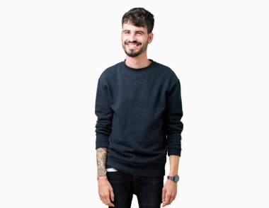 Genç yakışıklı adam seksi bir ifadeyle, neşeli ve mutlu yüzünü kameraya bakarak göz kırpıyor izole arka plan üzerinde.