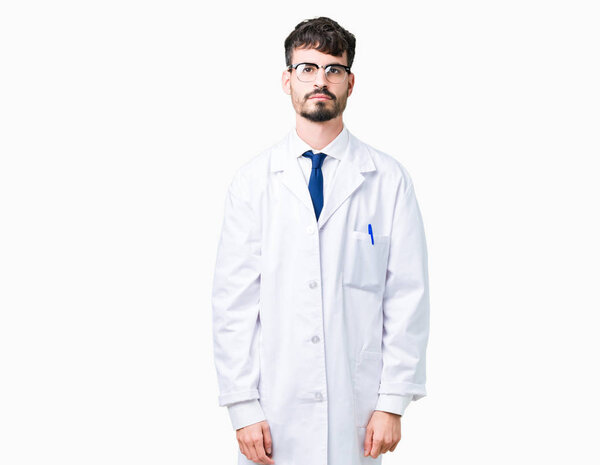 Young professional scientist man wearing white coat over isolated background Relaxed with serious expression on face. Simple and natural looking at the camera.
