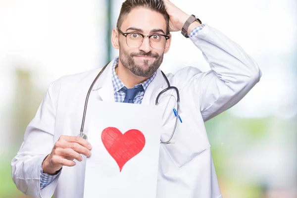 Joven Doctor Guapo Sosteniendo Papel Con Corazón Rojo Sobre Fondo — Foto de Stock