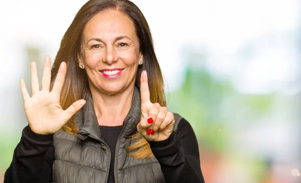 Beautiful Middle Age Woman Wearing Winter Vest Showing Pointing Fingers — Stock Photo, Image