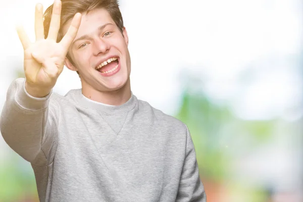 Junger Schöner Sportlicher Mann Der Sweatshirt Über Isoliertem Hintergrund Trägt — Stockfoto