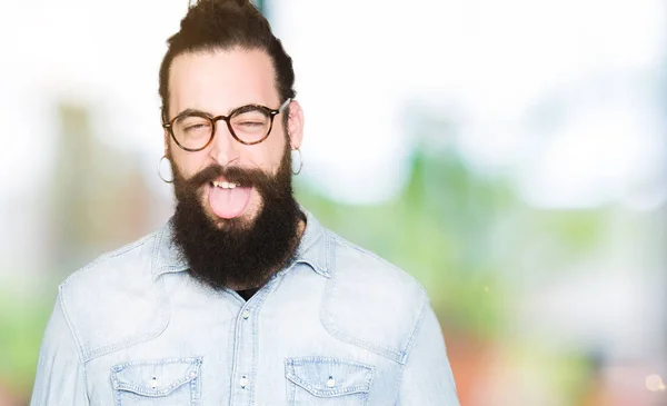 Young Hipster Man Long Hair Beard Wearing Glasses Sticking Tongue — Stock Photo, Image