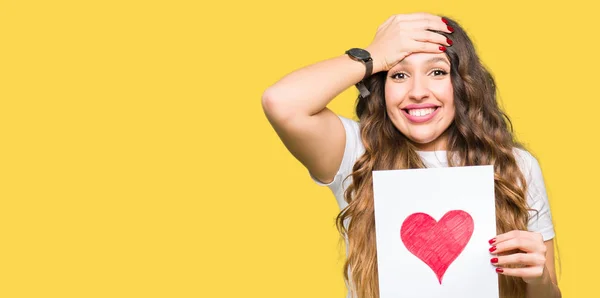 Young Adult Woman Holding Card Red Heart Stressed Hand Head — Stock Photo, Image
