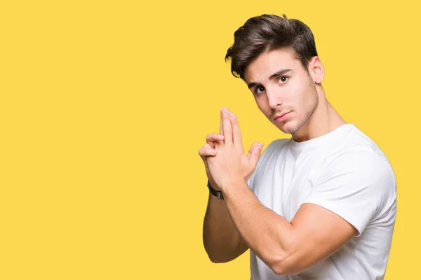 Joven Hombre Guapo Con Camiseta Blanca Sobre Fondo Aislado Sosteniendo — Foto de Stock