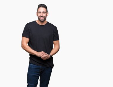 Genç yakışıklı adam arka plan eller birlikte izole ve rahat ve neşeli gülümseyen parmak çarpı işareti. Başarı ve iyimser