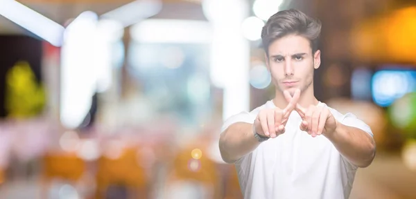 Jovem Bonito Homem Vestindo Branco Shirt Sobre Isolado Fundo Rejeição — Fotografia de Stock