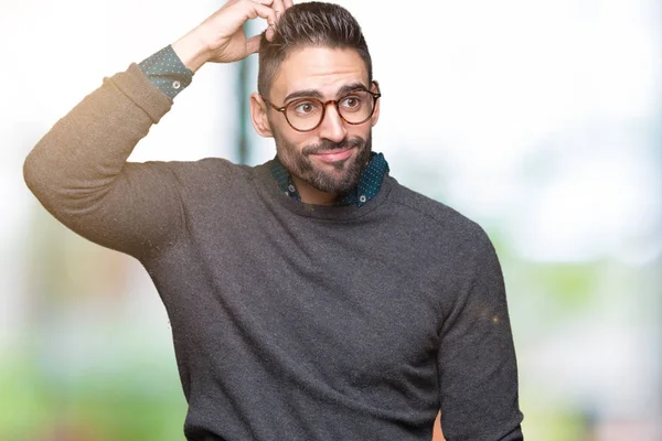 Joven Hombre Guapo Con Gafas Sobre Fondo Aislado Confundir Preguntarse —  Fotos de Stock