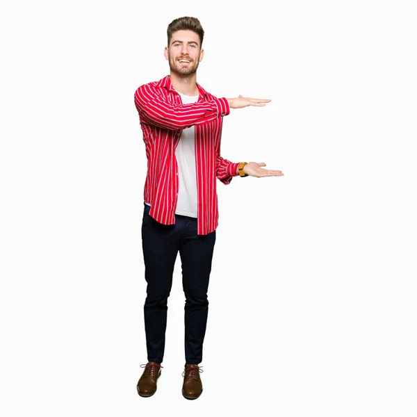 Young Handsome Man Wearing Red Shirt Gesturing Hands Showing Big — Stock Photo, Image