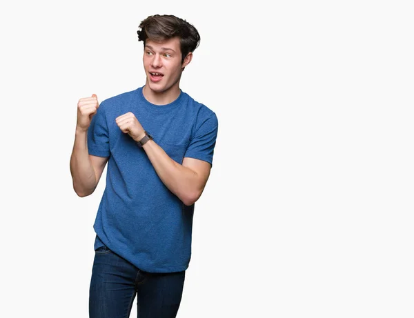 Jovem Homem Bonito Vestindo Camiseta Azul Sobre Fundo Isolado Apontando — Fotografia de Stock