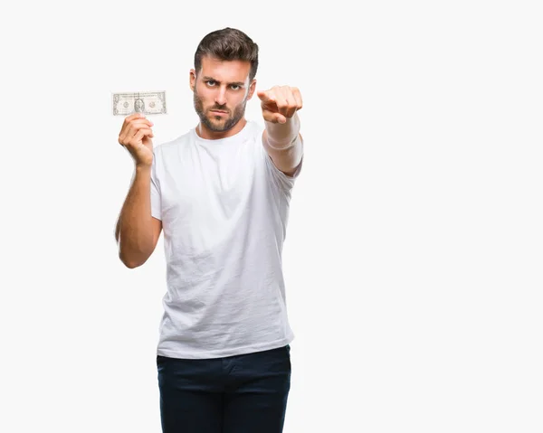 Joven Hombre Guapo Sosteniendo Dólares Sobre Fondo Aislado Señalando Con —  Fotos de Stock