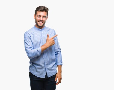 Yakışıklı delikanlı izole arka neşeli bir gülümseme ile el ve parmak kadar kameraya bakarak yüzündeki mutlu ve doğal ifade ile yan ile işaret yüz üzerinden.