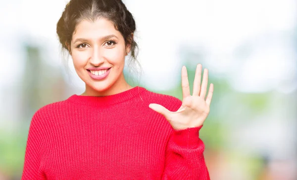 Młoda Piękna Kobieta Ubrana Czerwony Sweter Kok Pokazując Wskazując Palce — Zdjęcie stockowe
