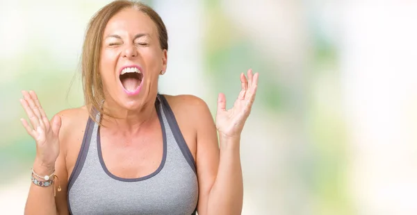 Mooie Middelbare Leeftijd Vrouw Sport Kleding Dragen Geïsoleerd Achtergrond Vieren — Stockfoto