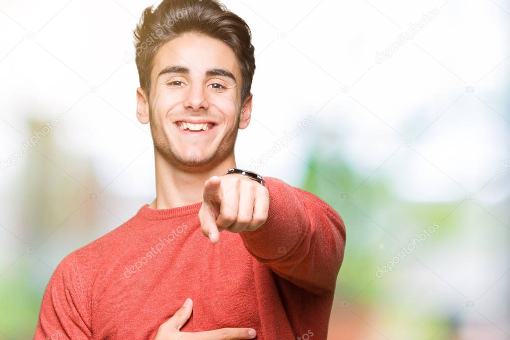 Young handsome man over isolated background Laughing of you, pointing to the camera with finger hand over chest, shame expression