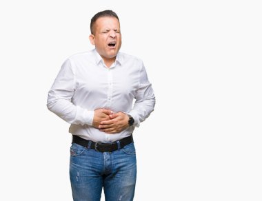 Orta yaş Arap zarif adam izole mide üzerinde el ile arka plan çünkü hazımsızlık, ağrılı hastalık hasta hissediyor. Ağrısı kavramı.