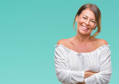 Orta yaş izole arka plan mutlu yüz çapraz silah kameraya bakarak ile gülümseyen kıdemli İspanyol kadın. Olumlu bir kişi.