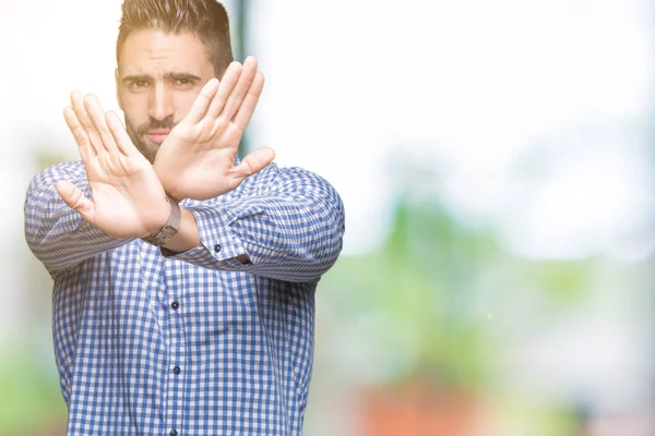 Jonge Knappe Man Geïsoleerde Achtergrond Afwijzing Expressie Kruising Armen Handpalmen — Stockfoto