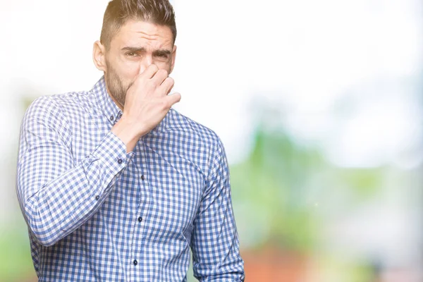 Junger Gutaussehender Mann Mit Isoliertem Hintergrund Der Etwas Stinkendes Und — Stockfoto