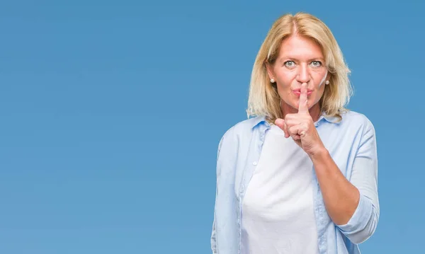 Middle Age Blonde Woman Isolated Background Asking Quiet Finger Lips — Stock Photo, Image