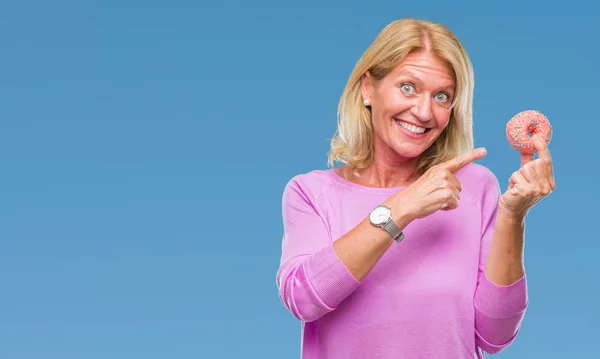 Middle Age Blonde Woman Eating Pink Donut Isolated Background Very — Stock Photo, Image