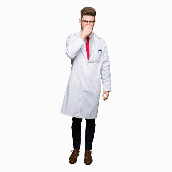 Young Handsome Scientist Man Wearing Glasses Smelling Something Stinky Disgusting — Stock Photo, Image