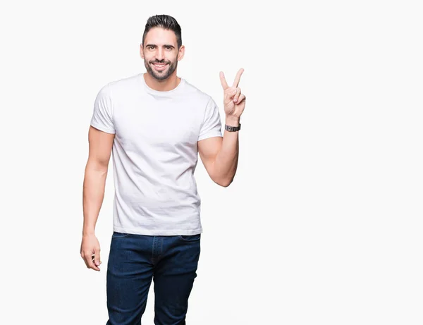 Jovem Vestindo Camiseta Branca Casual Sobre Fundo Isolado Sorrindo Com — Fotografia de Stock