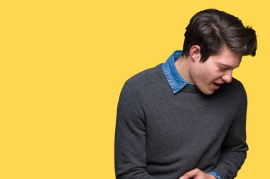 Genç yakışıklı zarif adam izole mide üzerinde el ile arka plan çünkü mide bulantısı, ağrılı hastalık hasta hissediyor. Ağrısı kavramı.