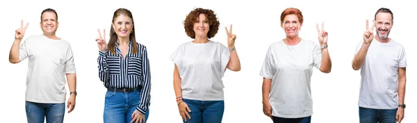 Collage Group Senior People Isolated Background Showing Pointing Fingers Number — Stock Photo, Image