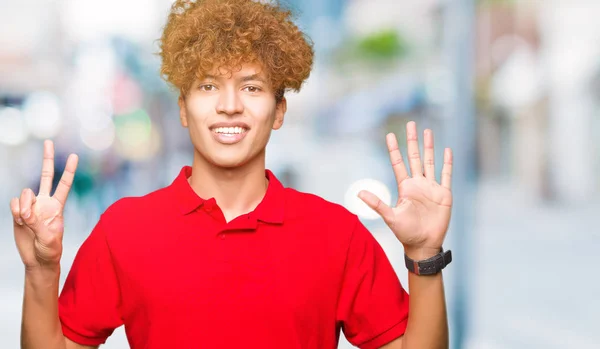 Joven Hombre Guapo Con Pelo Afro Usando Camiseta Roja Mostrando — Foto de Stock