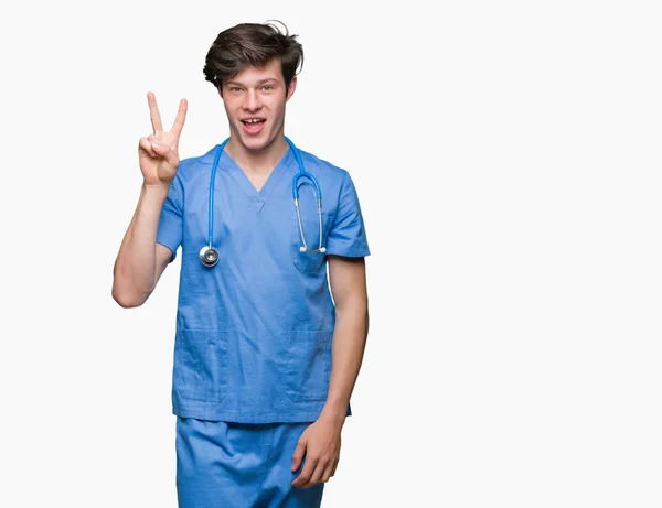 Jovem Médico Vestindo Uniforme Médico Sobre Fundo Isolado Mostrando Apontando — Fotografia de Stock