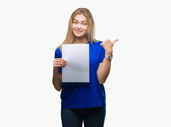 Young Caucasian Woman Holding Blank Paper Sheet Isolated Background Pointing — Stock Photo, Image