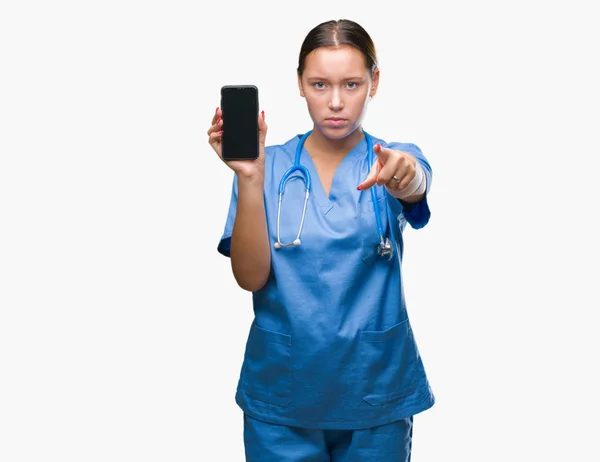 Young Caucasian Doctor Woman Showing Smarpthone Isolated Background Pointing Finger — Stock Photo, Image