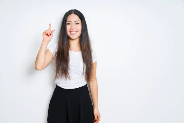 Schöne Brünette Frau Über Isolierten Hintergrund Zeigt Mit Dem Finger — Stockfoto