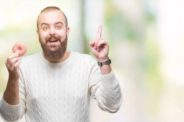 Jeune Homme Hipster Caucasien Mangeant Beignet Sucré Sur Fond Isolé — Photo