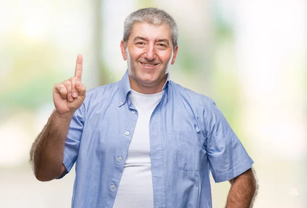 Hombre Mayor Guapo Sobre Fondo Aislado Mostrando Señalando Con Dedo —  Fotos de Stock