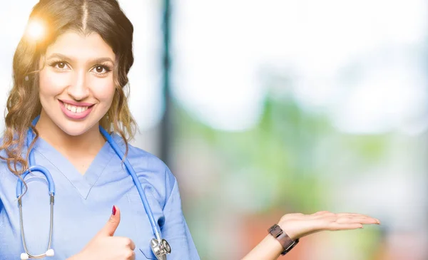 Young Adult Doctor Woman Wearing Medical Uniform Showing Palm Hand — Stock Photo, Image