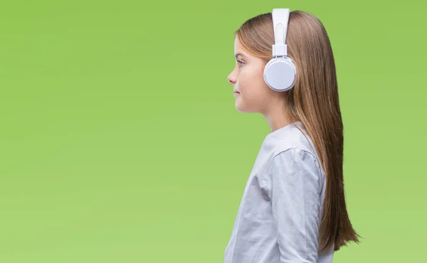 Joven Hermosa Chica Con Auriculares Escuchando Música Sobre Fondo Aislado — Foto de Stock