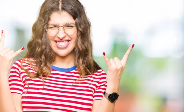 Young Beautiful Woman Wearing Glasses Shouting Crazy Expression Doing Rock — Stock Photo, Image
