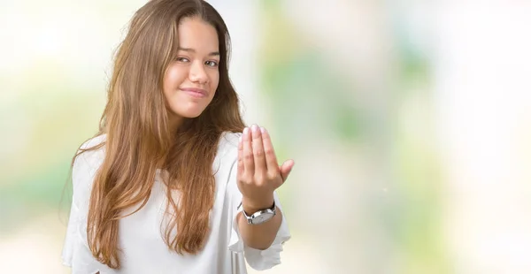 stock image Young beautiful brunette business woman over isolated background Beckoning come here gesture with hand inviting happy and smiling