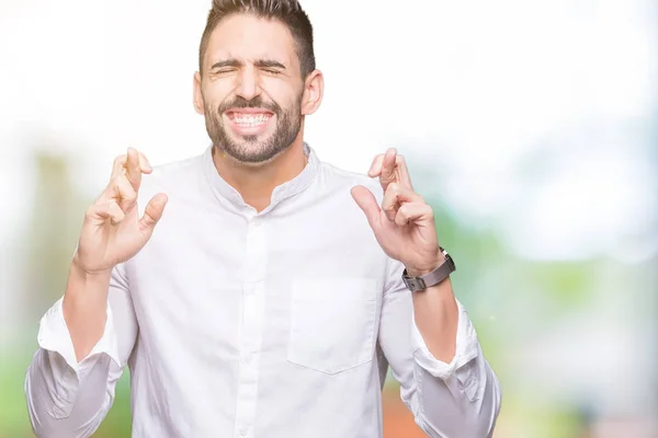 Jovem Homem Negócios Sobre Fundo Isolado Sorrindo Cruzando Dedos Com — Fotografia de Stock