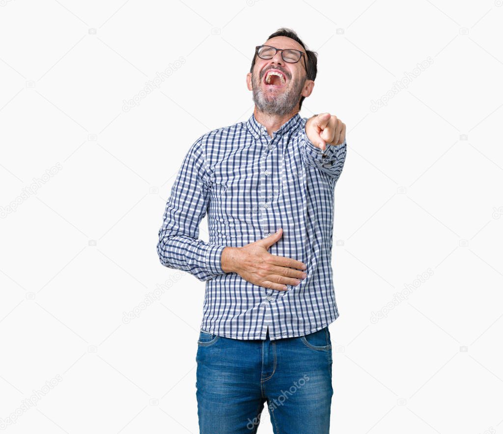 Handsome middle age elegant senior man wearing glasses over isolated background Laughing of you, pointing to the camera with finger hand over chest, shame expression